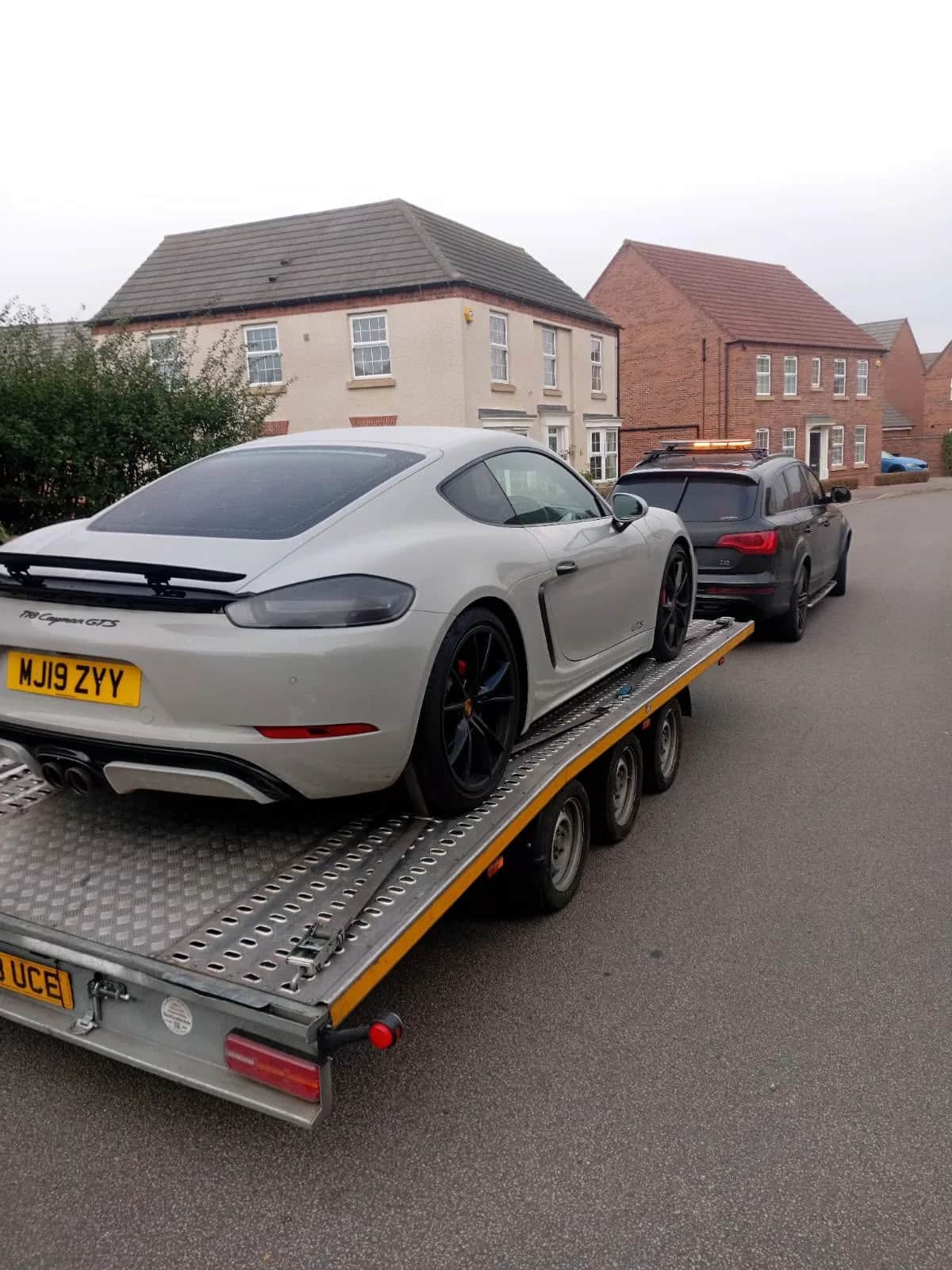Porsche Cayman GTS secured on a KYS Recovery trailer